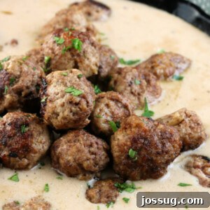 Closeup of Swedish Meatballs in gravy, illustrating their rich texture and appetizing appearance.