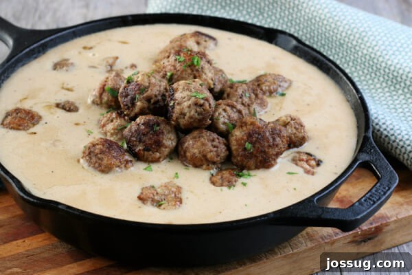 A final close-up of a serving of Swedish Meatballs in their rich, brown sour cream gravy, emphasizing the inviting texture and appealing presentation.