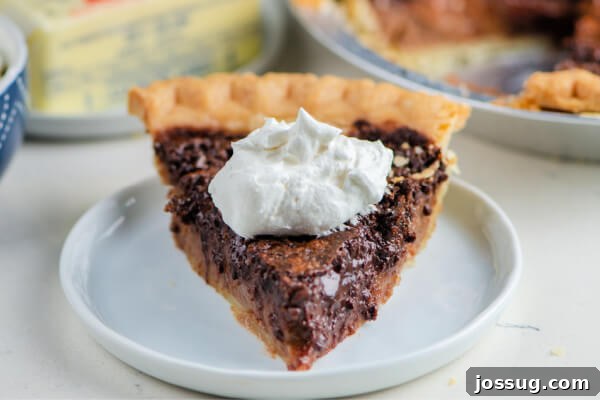 Decadent Chocolate Chess Pie 9 slice of chocolate chess pie on white plate