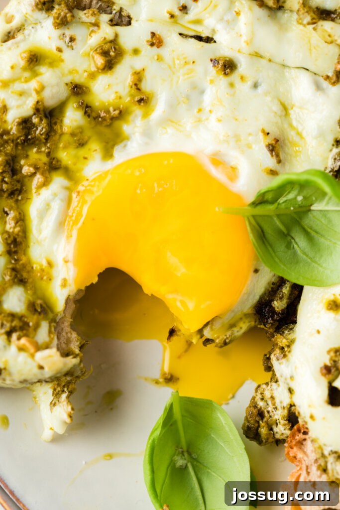 Close-up of Cooked Pesto Eggs with a Runny Yolk
