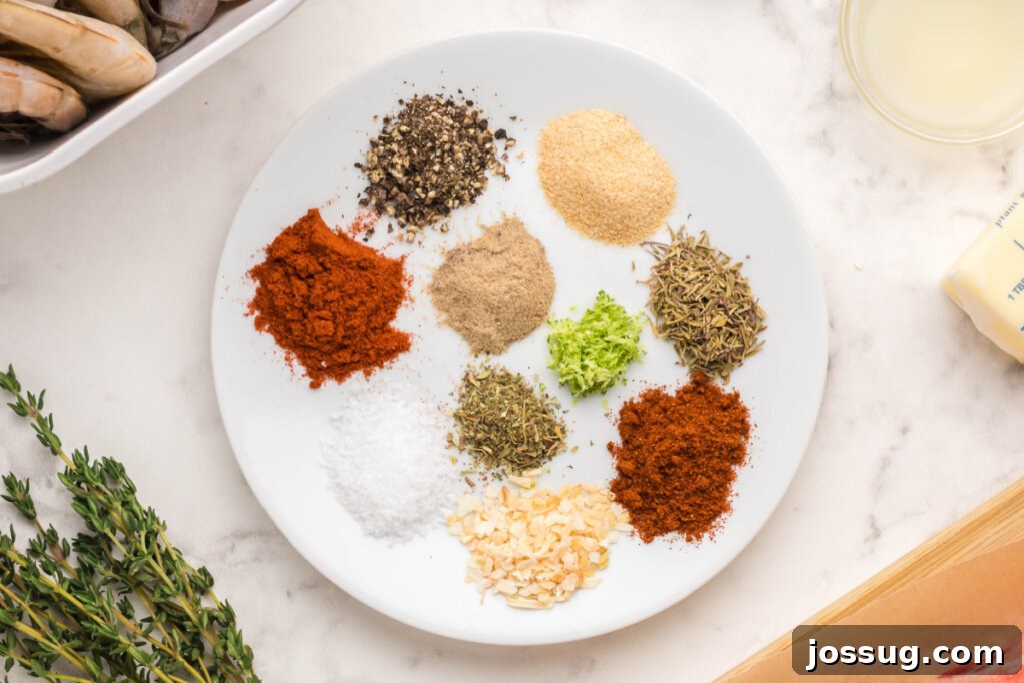 Cajun Blackened Seasoning 5 A collection of aromatic herbs and spices meticulously arranged on a clean white plate, symbolizing the fresh components of homemade seasoning.