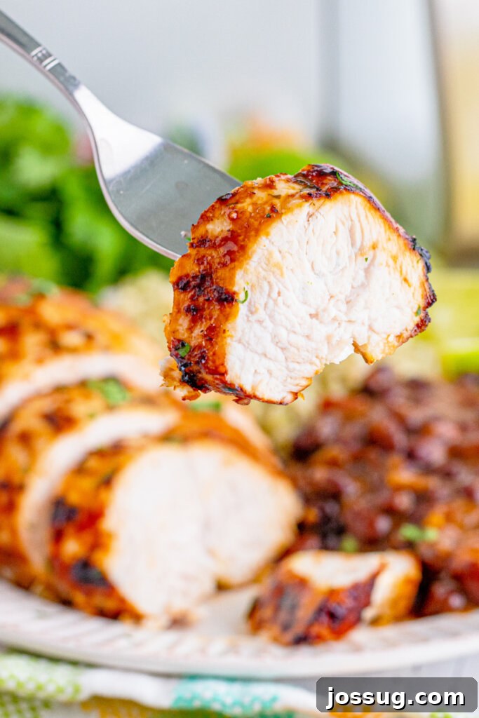 Cut piece of margarita chicken on fork
