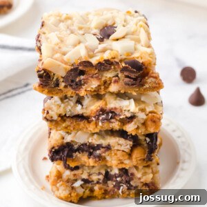 Miracle Layered Dessert Bars 6 magic cookie bars on white plate