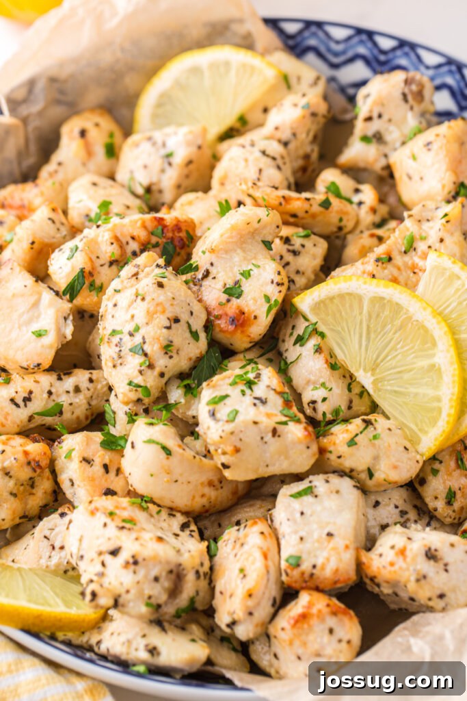 Zesty Lemon Air Fryer Chicken Morsels 2 bowl with lemon chicken bites and lemon slices