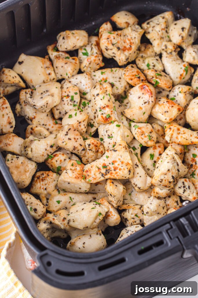 Zesty Lemon Air Fryer Chicken Morsels 3 cooked lemon chicken bites in air fryer basket