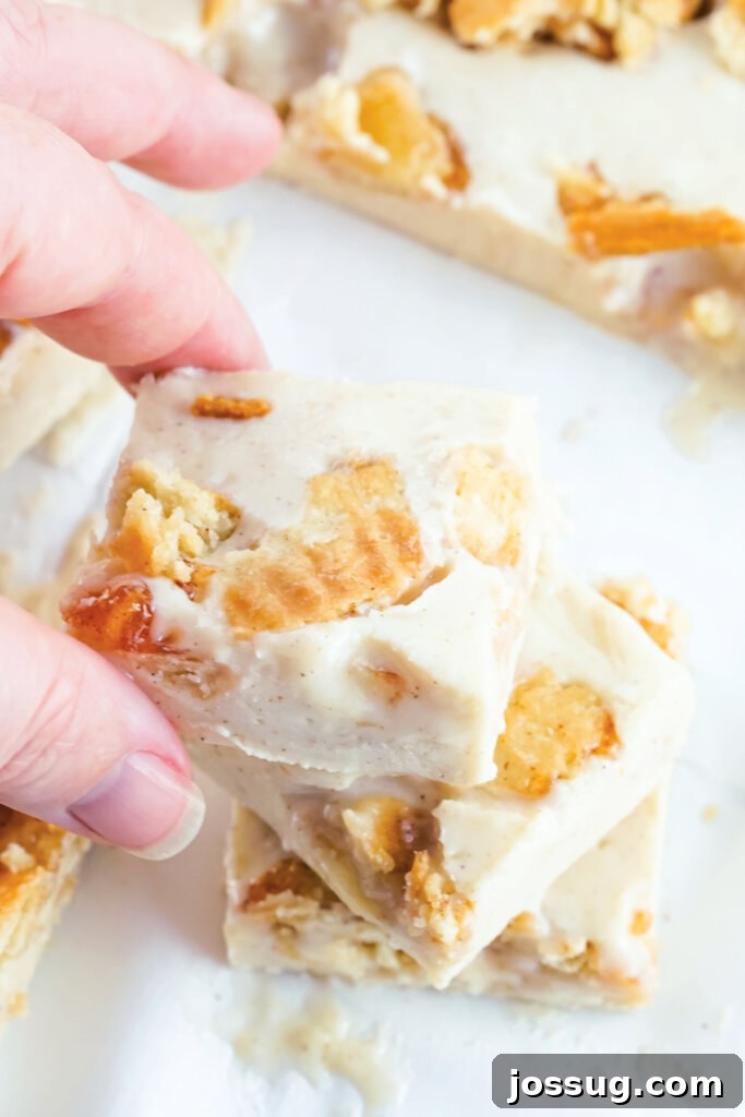 Spiced Apple Fudge 3 hand holding a square of apple pie fudge