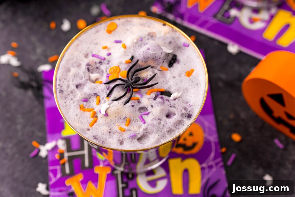 glass of halloween punch on napkin