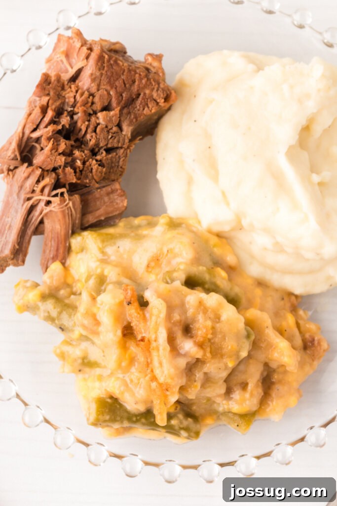 green bean casserole on plate with mashed potatoes and pot roast