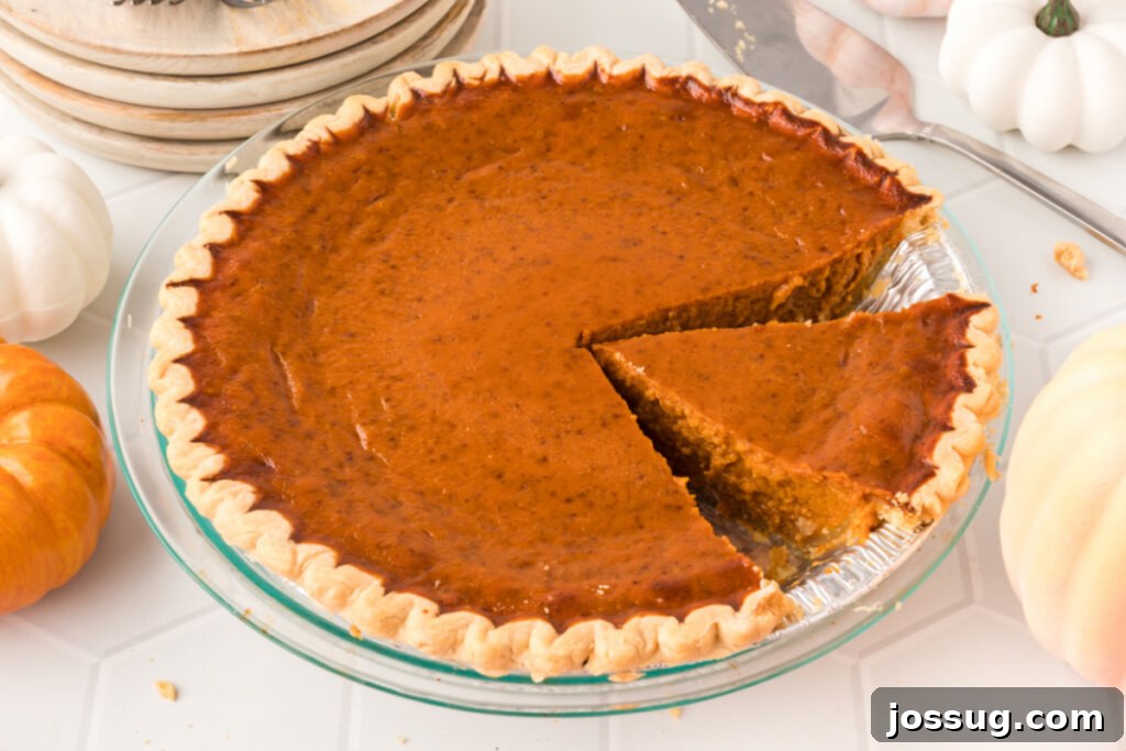 pumpkin pie with slice cut