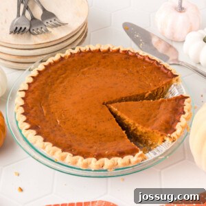 pumpkin pie with slice cut