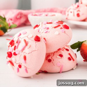 Close-up of vibrant Jello Meringues stacked on a plate, highlighting their beautiful colors and airy texture.