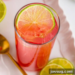 Bay Breeze cocktail with a lime wheel garnish, presented in a recipe card format.