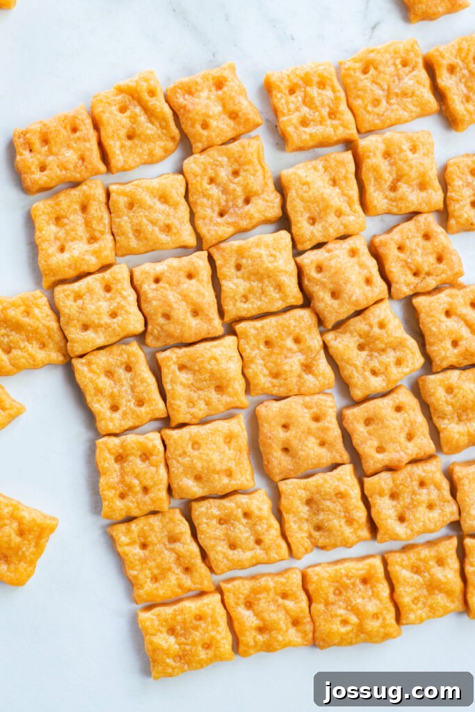 Cheesy Bites 3 Crispy homemade cheese crackers scattered on a clean white background.
