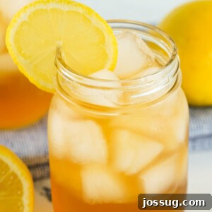 Arnold Palmer cocktail garnished with lemon slices, a refreshing summer drink.