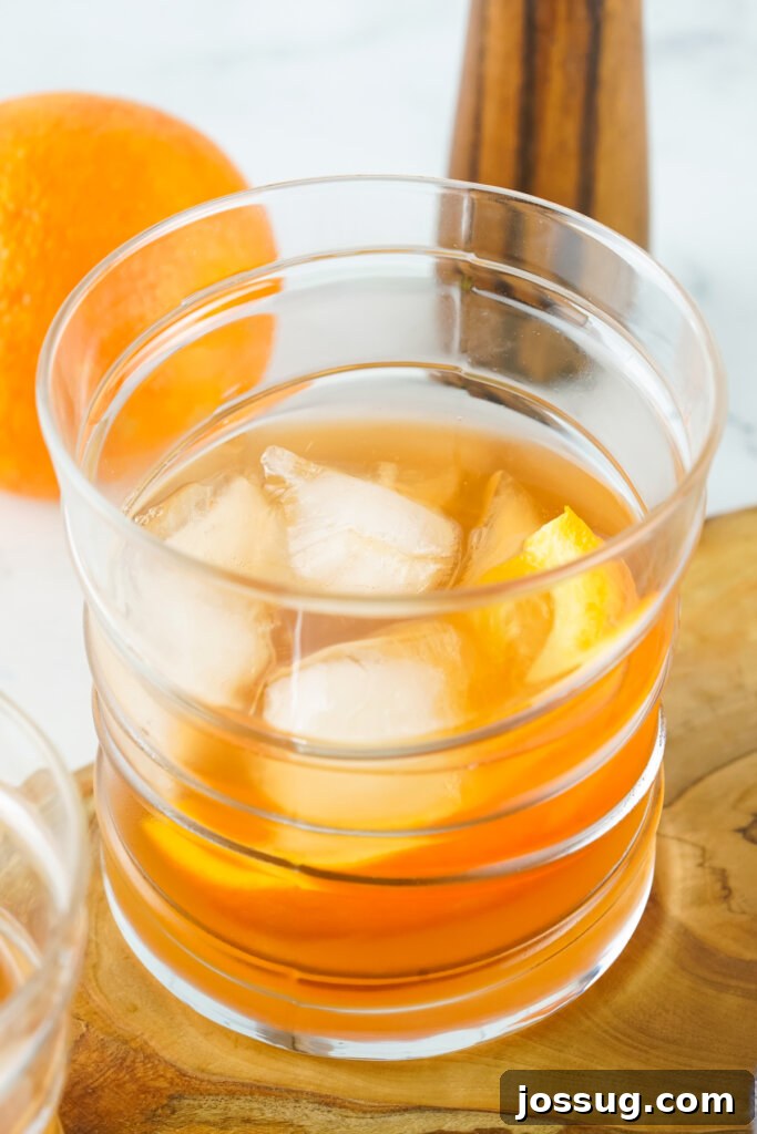 looking down into glass with old fashioned cocktail
