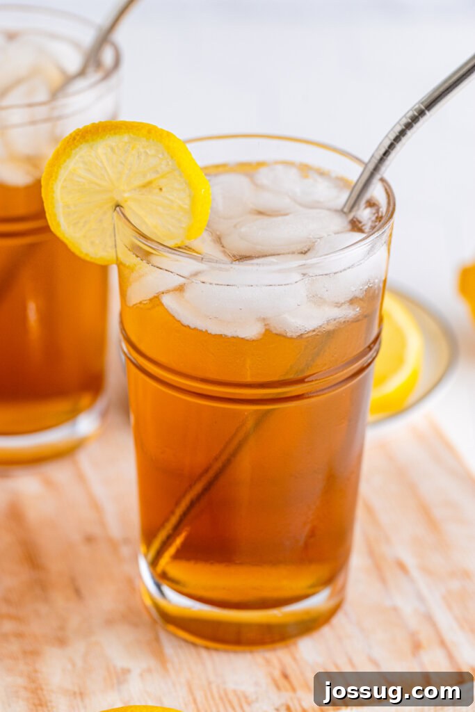 Long Island's Potent Mirage 4 A single Long Island Iced Tea cocktail presented on a rustic wooden board, emphasizing its refreshing appeal.
