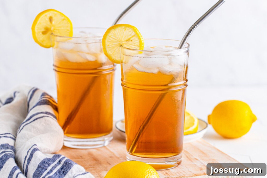 Long Island's Potent Mirage 6 Two long island iced tea cocktails, perfectly garnished and ready to be served at a gathering.
