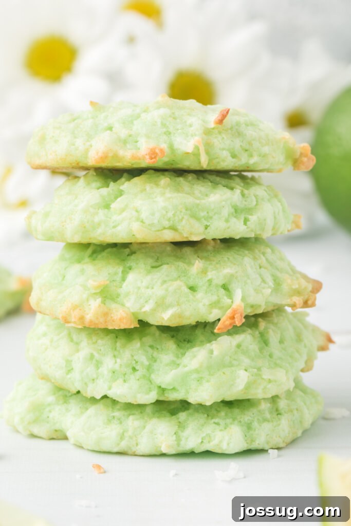 Syrup-Kissed Coconut Delights 3 Stack of freshly baked lime coconut cookies on a white plate