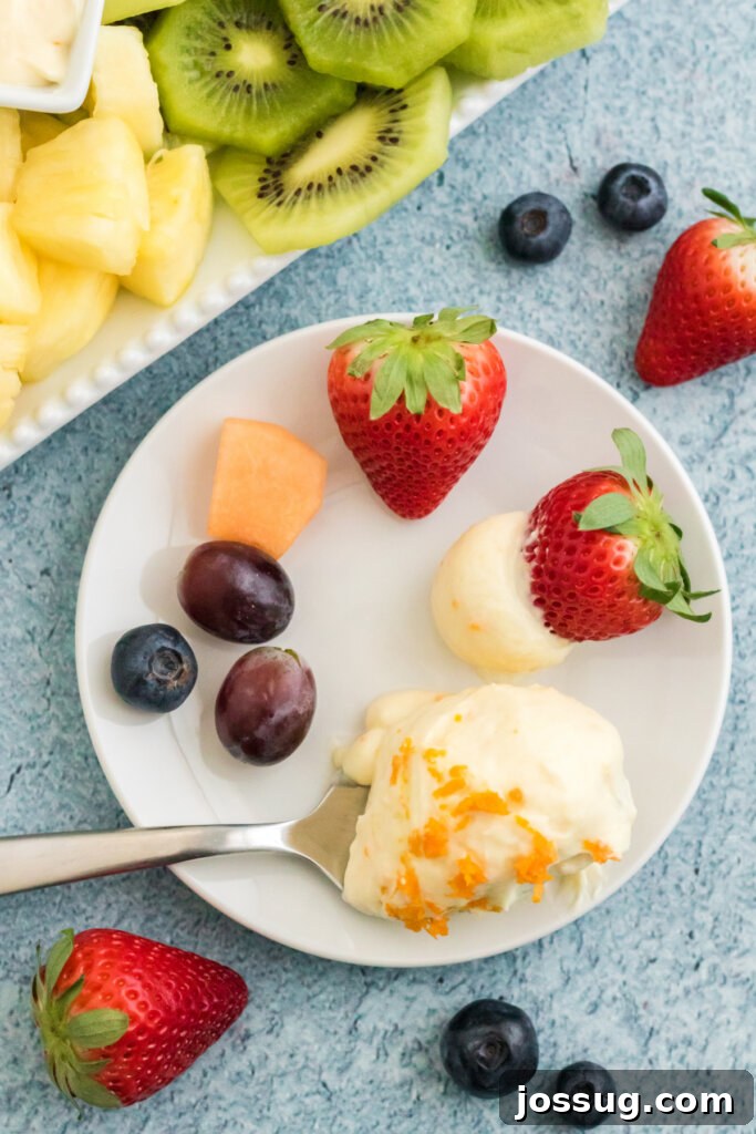 Orange Dream Fruit Dip 5 Assorted fresh fruit on plate with a scoop of orange creamsicle fruit dip