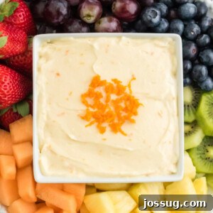 Closeup of orange fruit dip in square bowl
