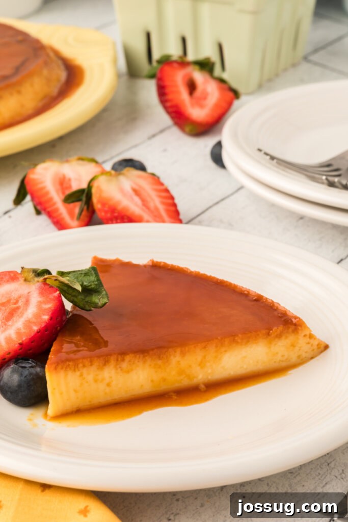 Velvety Caramel Flan 4 Close-up of a Spanish flan slice on a plate, showing its smooth custard and glossy caramel.