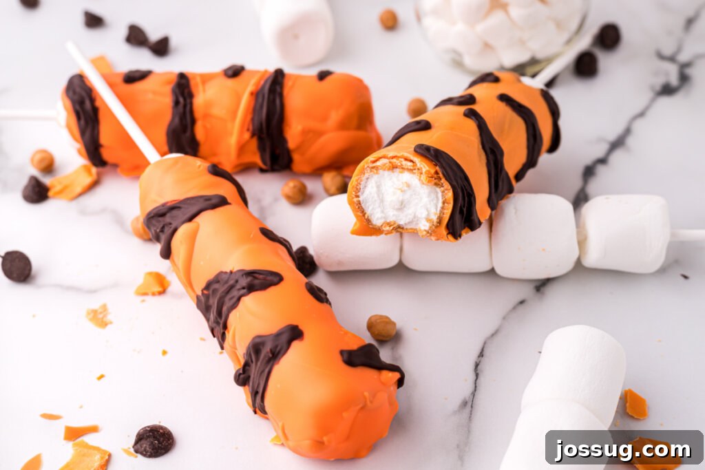 A close-up of Tigger Tails showing the vibrant orange coating and dark chocolate stripes.