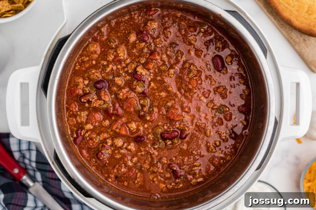 Quick-Fix Instant Pot Chili 4 Close-up view of chili simmering inside an Instant Pot, rich with meat, beans, and vegetables.