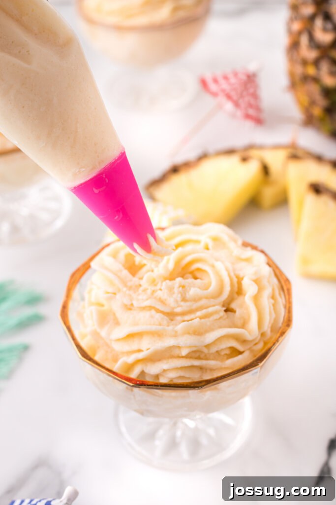 piping bag filling bowl with dole whip, showing its creamy texture