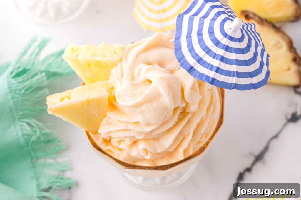 disney dole whip with blue and white striped umbrella, perfect for a sunny day