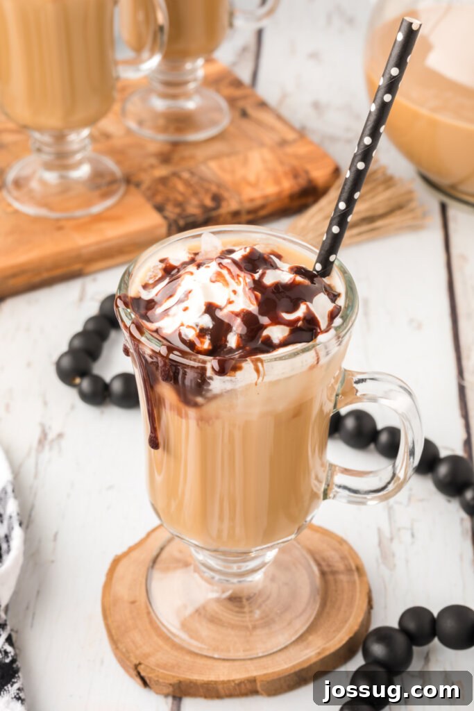 best iced coffee topped with whipped cream and chocolate drizzle
