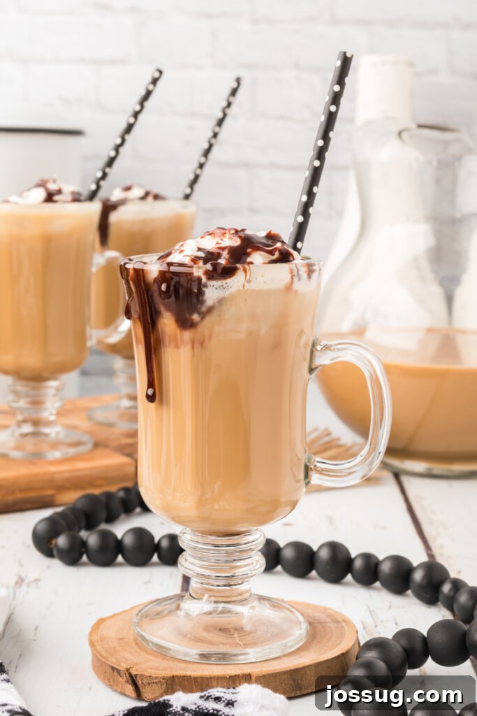 iced coffee in clear glass on wooden coaster