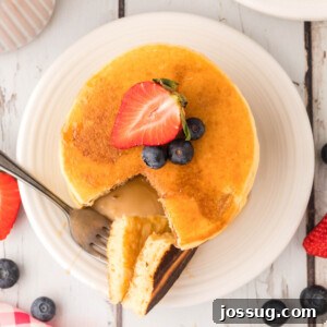Overhead view of a stack of fluffy buttermilk pancakes, ready to be served