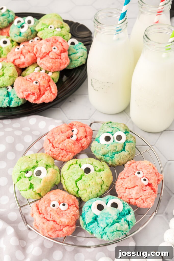 halloween cookies on cooling rack with milk bottles next to it