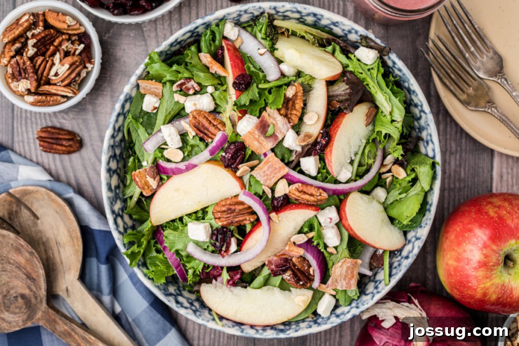 Looking down into a large, inviting bowl of Thanksgiving salad, perfectly mixed and ready to serve.