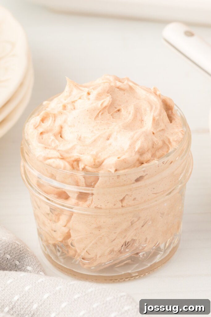 Homemade Texas Roadhouse Cinnamon Butter in a elegant glass jar, showcasing its smooth texture and inviting color