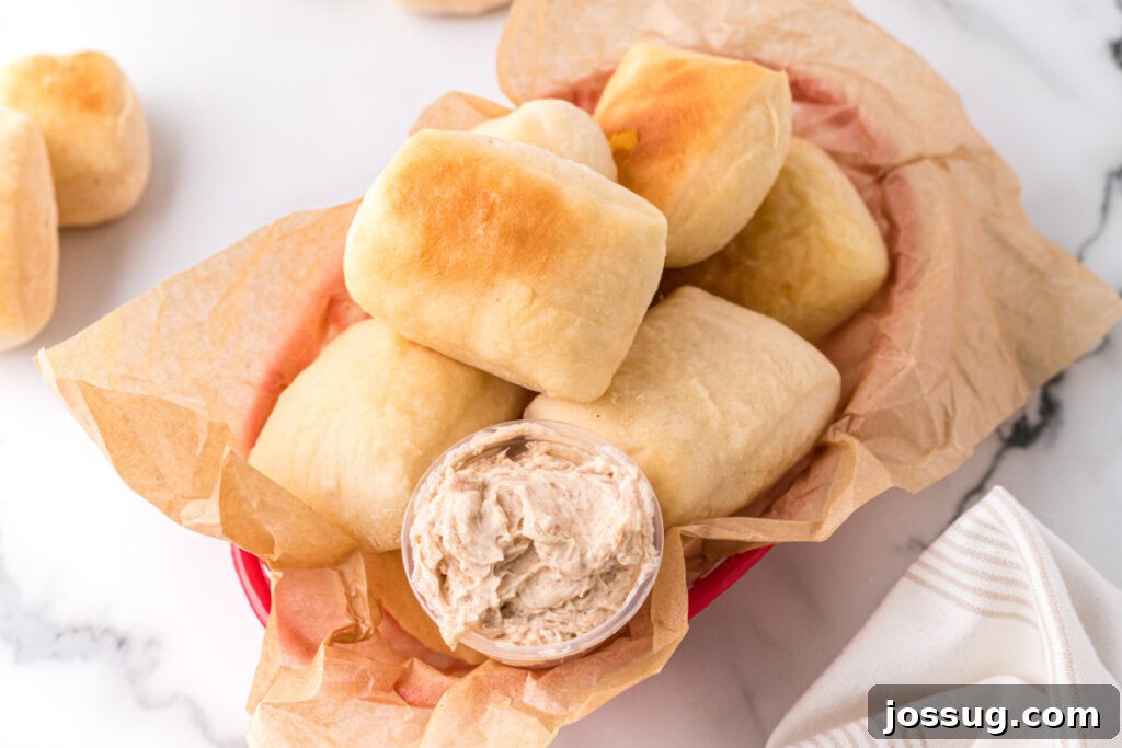 looking down into a basket of copycat texas roadhouse rolls