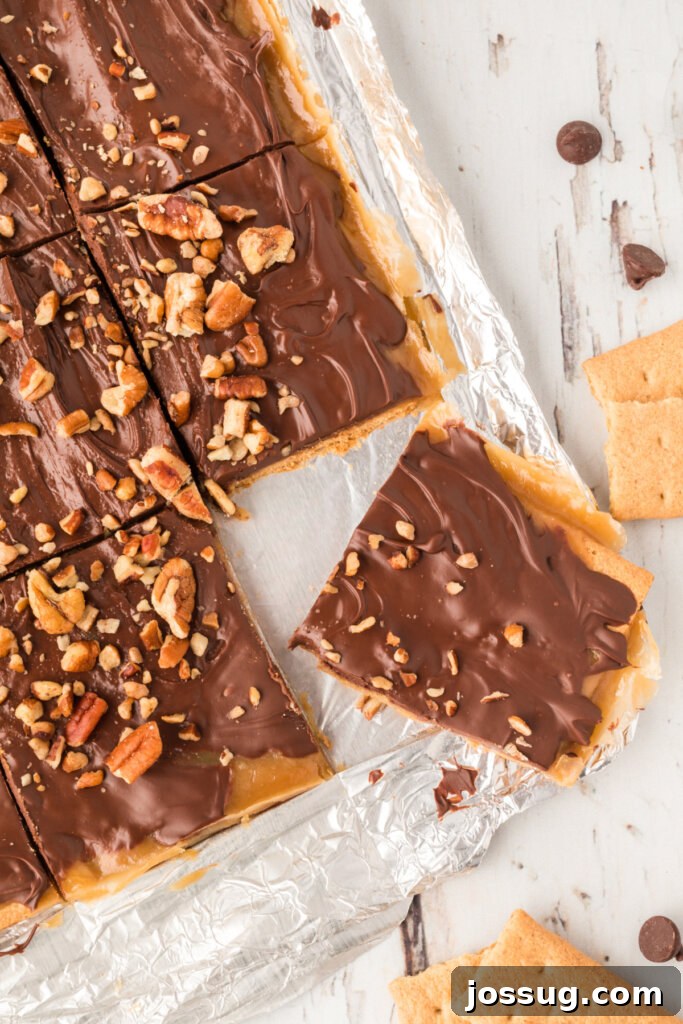 one piece of graham cracker toffee broken off a slab