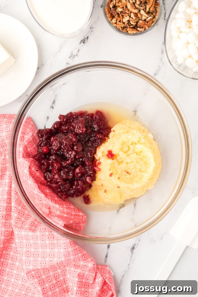 place the cranberry auce and pineapple in a large bowl