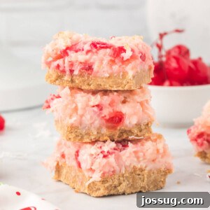 three cherry coconut magic bars stacked