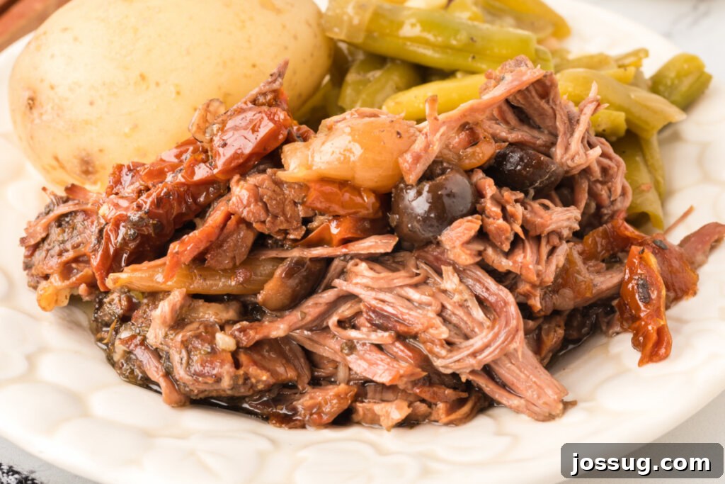 Mediterranean Sunshine Slow Cooker Pot Roast 6 mediterranean pot roast on plate with potato and green beans