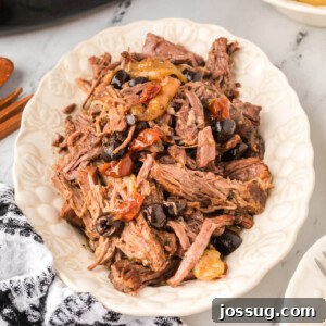 shredded slow cooker mediterranean pot roast on platter