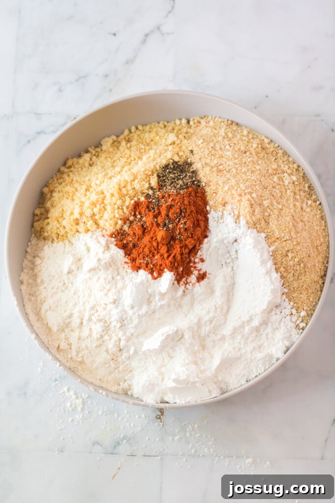 Breading ingredients in a bowl, showing the various components for the homemade Chick-fil-A nugget coating.