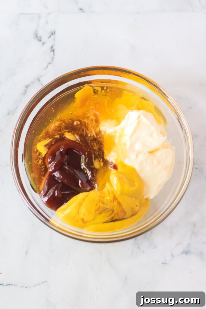 All the Chick-fil-A sauce ingredients have been added to a single bowl, ready for whisking.
