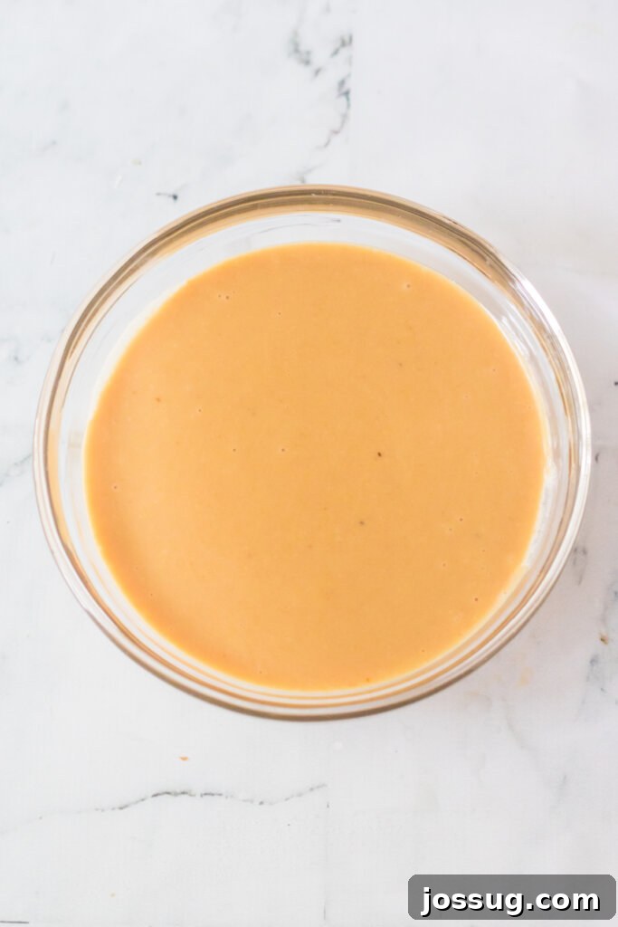 The finished, smooth, and creamy Chick-fil-A sauce in a bowl, ready for dipping.