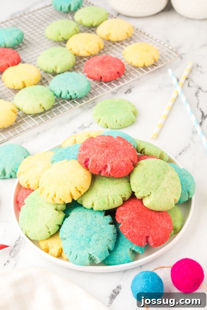 A vibrant plateful of various colored Jello cookies, showcasing their fruity appearance
