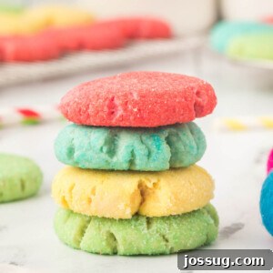Four Jello cookies stacked showcasing their soft texture and vibrant colors