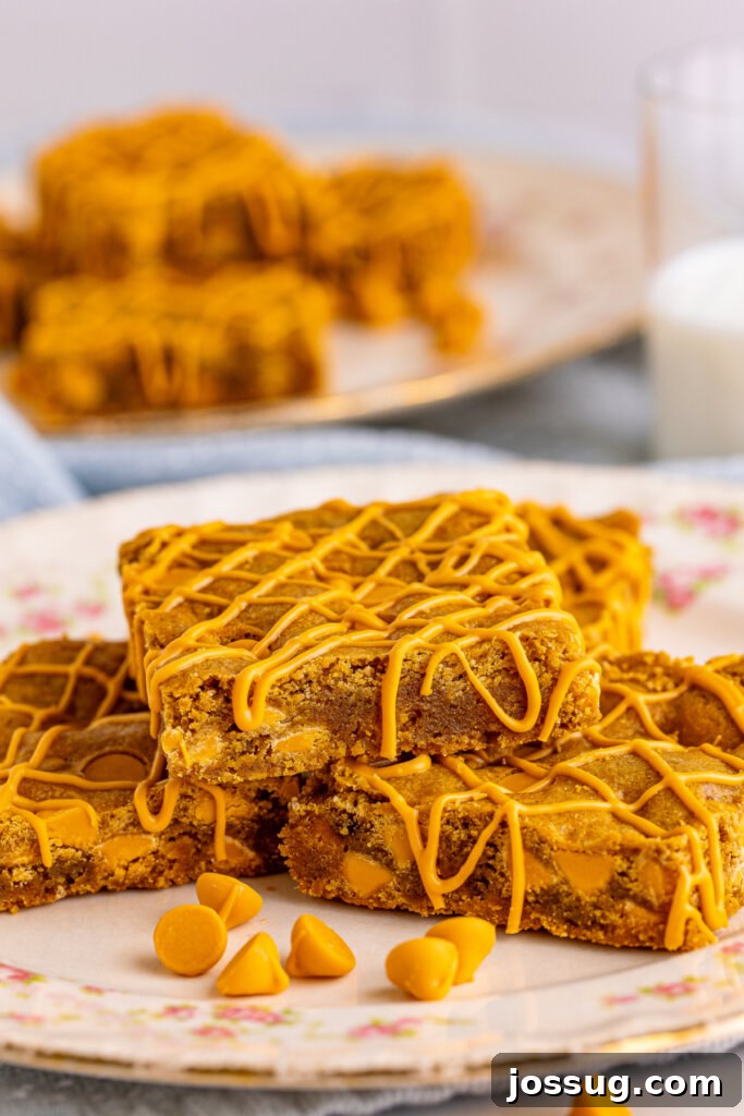 perfectly cut butterscotch blondie dessert bars on a rustic serving plate