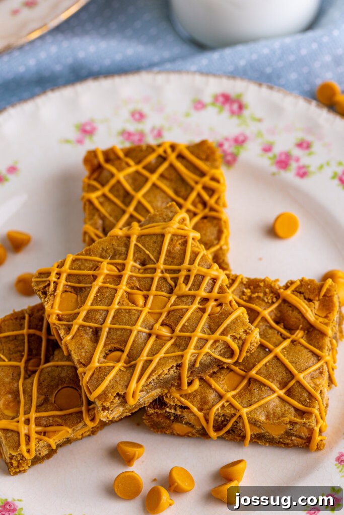 looking down onto a plate with butterscotch blondie bars, showing the rich, golden color and chip distribution