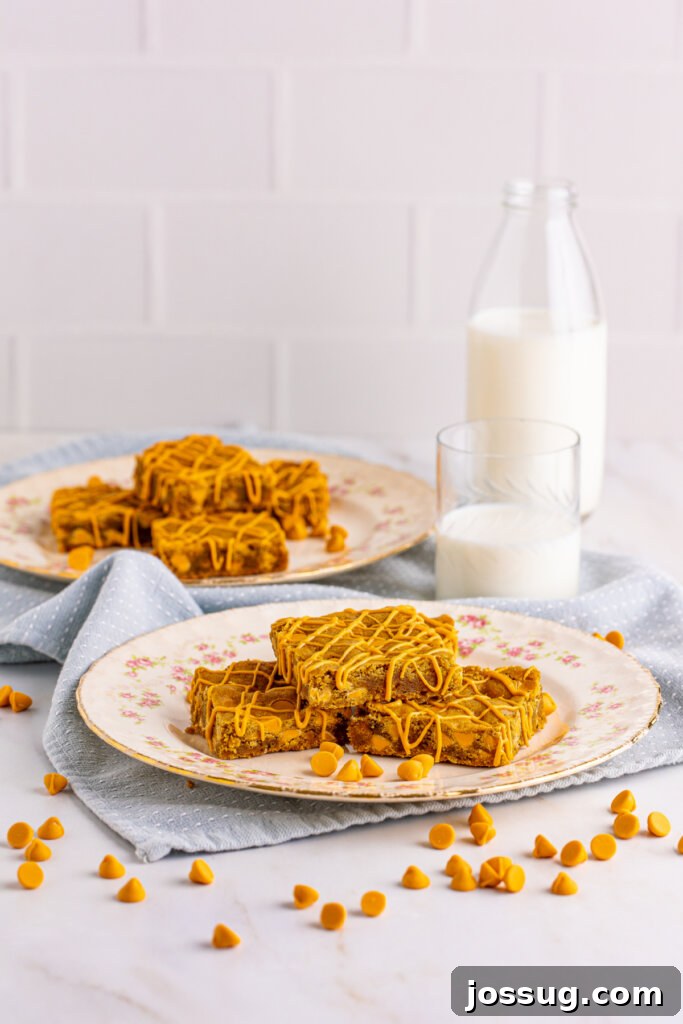 individual butterscotch blondies on small white plates, ready to be served