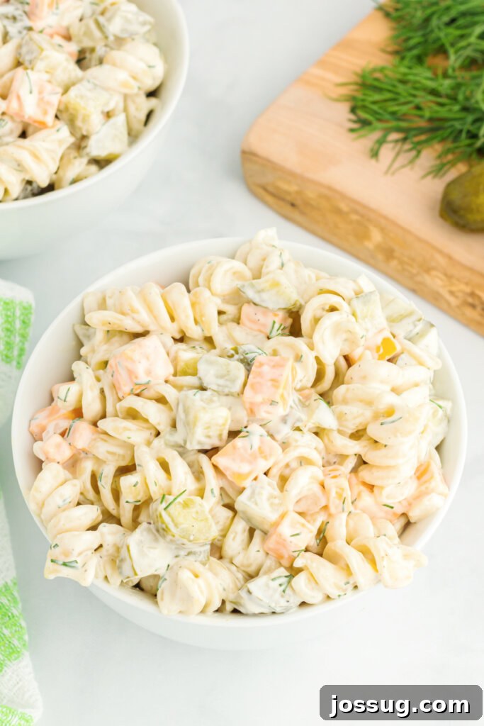 Dill Pickle Pasta Salad in a white serving bowl, ready to be enjoyed